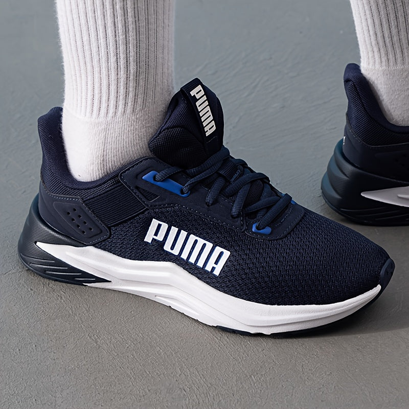 Chaussures PUMA pour hommes légères et breathables, toutes saisons, design bleu marine et blanc, semelle en caoutchouc et upper en fabric, support de stabilité